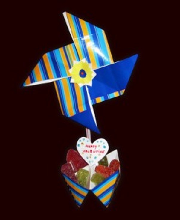 A pinwheel with a straw candy stand