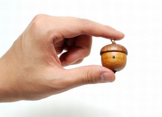 Handmade acorn-shaped speaker crafted from apricot wood - Ecofriend