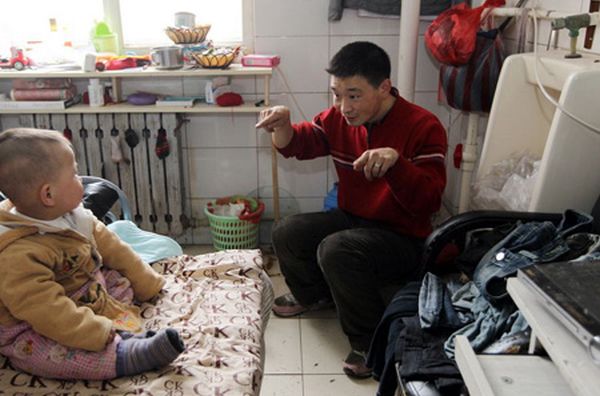 Chinese family lives in rented toilet, transforms it into cosy home
