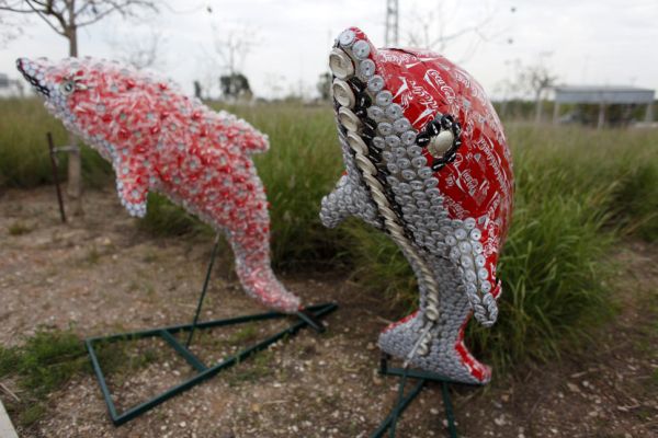 Safari of animals crafted from Coca-Cola trash