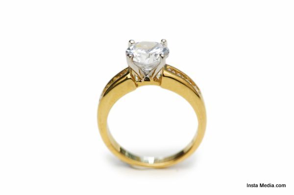 Golden ring with diamond isolated on the white