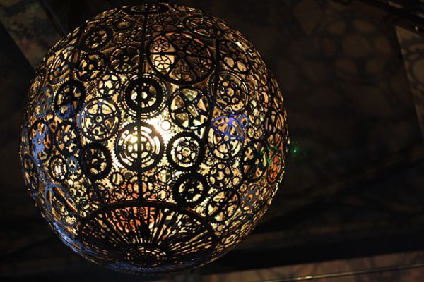 Recycled bike part chandeliers under a Texas overpass