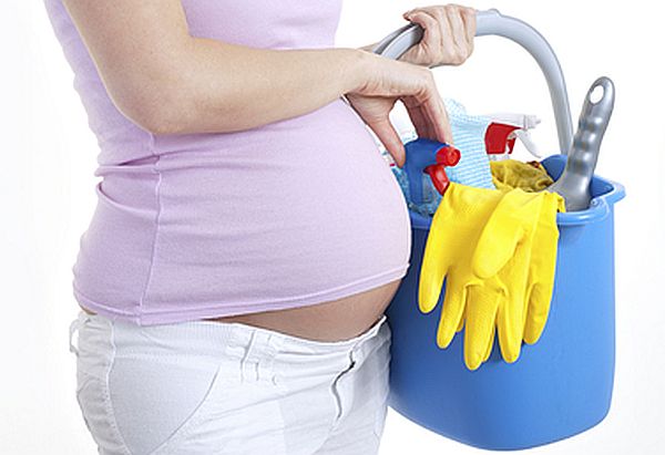 pregnant lady using cleaning products
