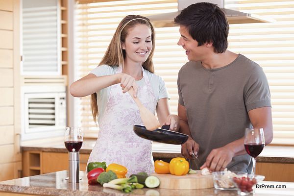 Couple cooking dinner in their kitchen