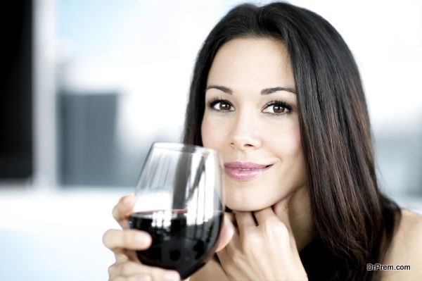 Young Woman Bartender with Red Wine Glasses