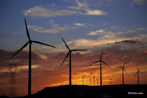 Wind turbines at a burning sunset