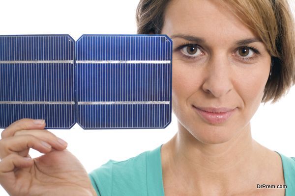 Woman holding solar panel