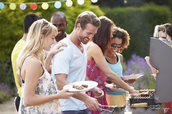 Group Of Friends Having Outdoor Barbeque At Home