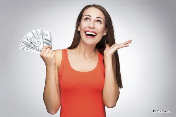 Woman holding dollar bills