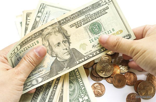 Woman's hand hold dollar bill on white background.