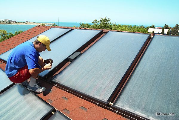 Worker installs solar panels