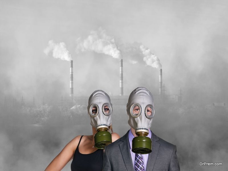 People wearing gas mask on factory background