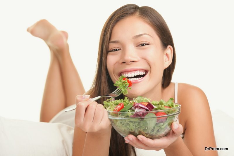 Woman eating salad