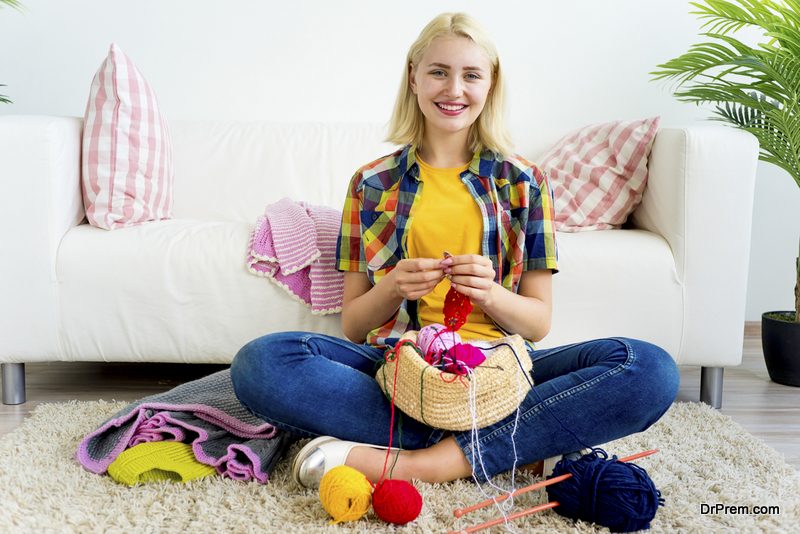 Girl knitting at home