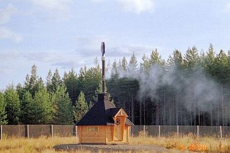 Vertical axis wind turbine that doubles as a chimney