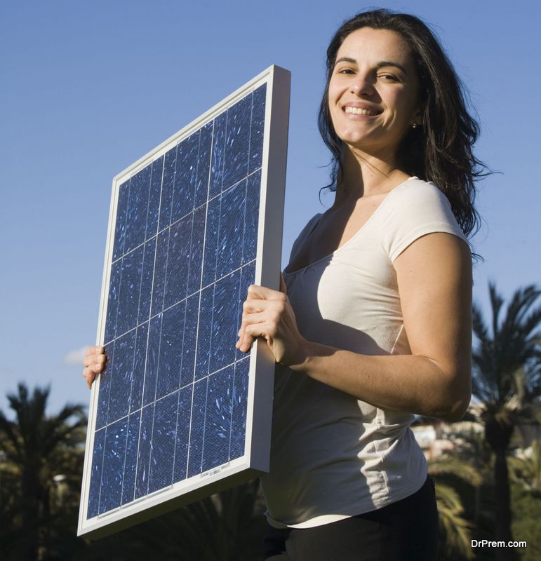 woman holding photovoltaic cell