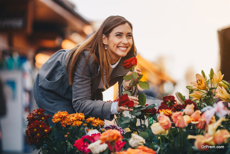 woman looking at Beautiful flowers