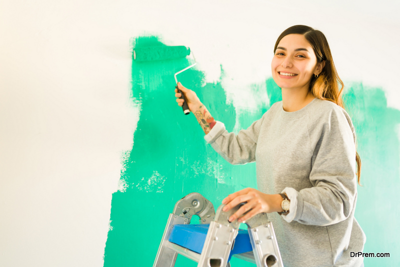 woman-using-low-Volatile-Organic-Compound-paint