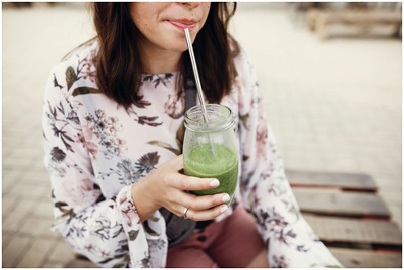 woman drinking with Straw