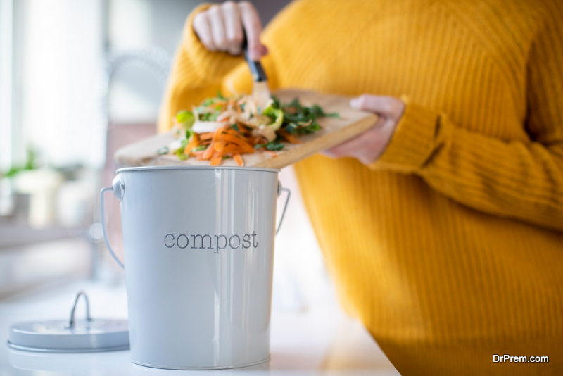 woman using Compost Bin