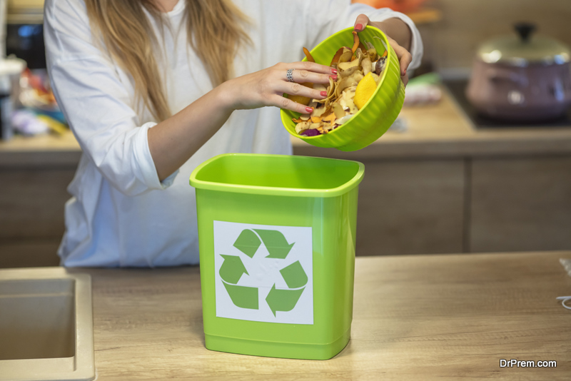 woman-using-Compost-Bin-at-home