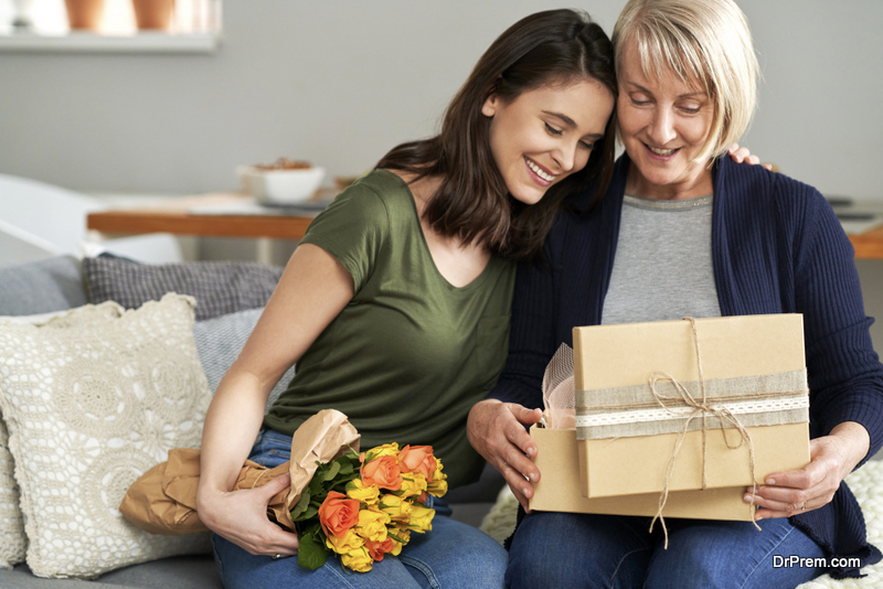 Mother and daughter unpacking a gift together