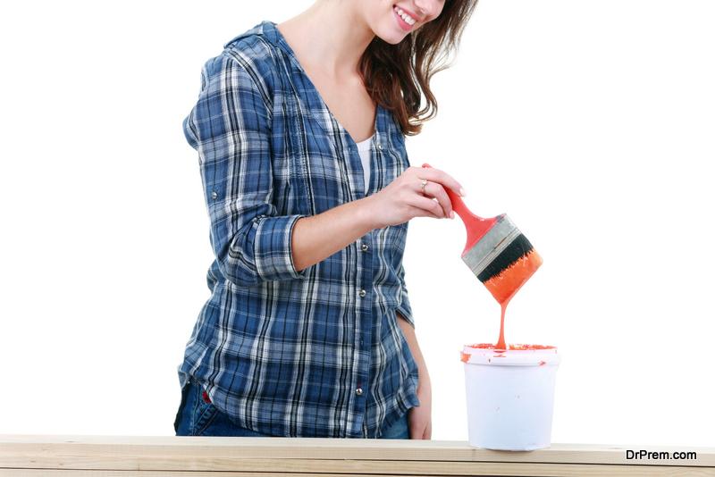 Beautiful Young Woman Doing Wall Painting