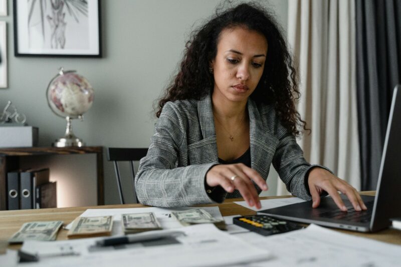 women paying bills